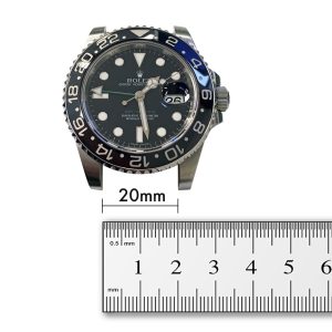 A normal watch and a ruler, indicating how to measure a watch lug width-for instance 20mm